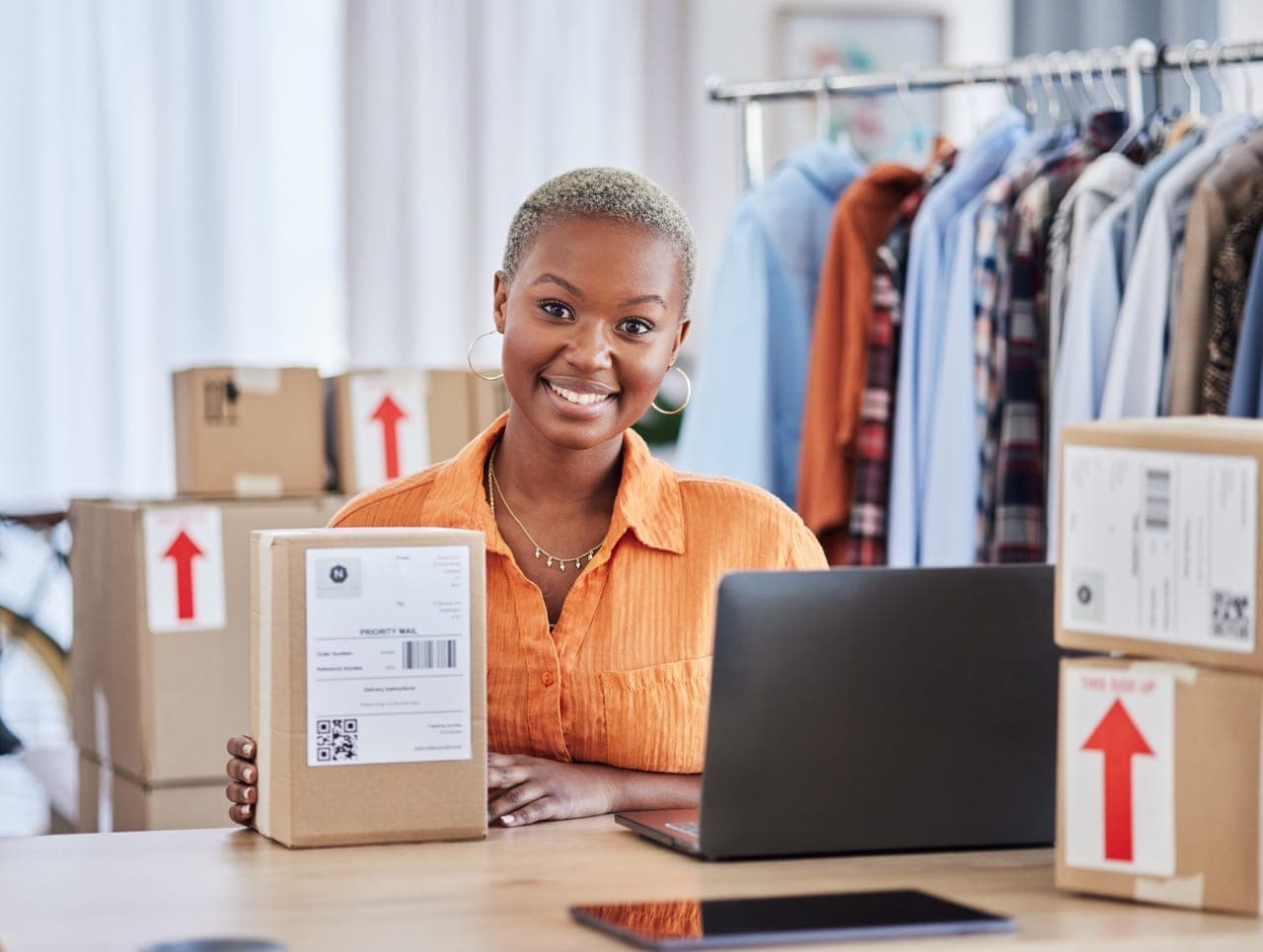 Black woman, portrait and box of fashion designer in small business logistics or service at boutiqu.