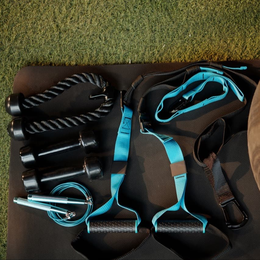 Fitness ball, triceps rope and various resistance bands ready for training in gym