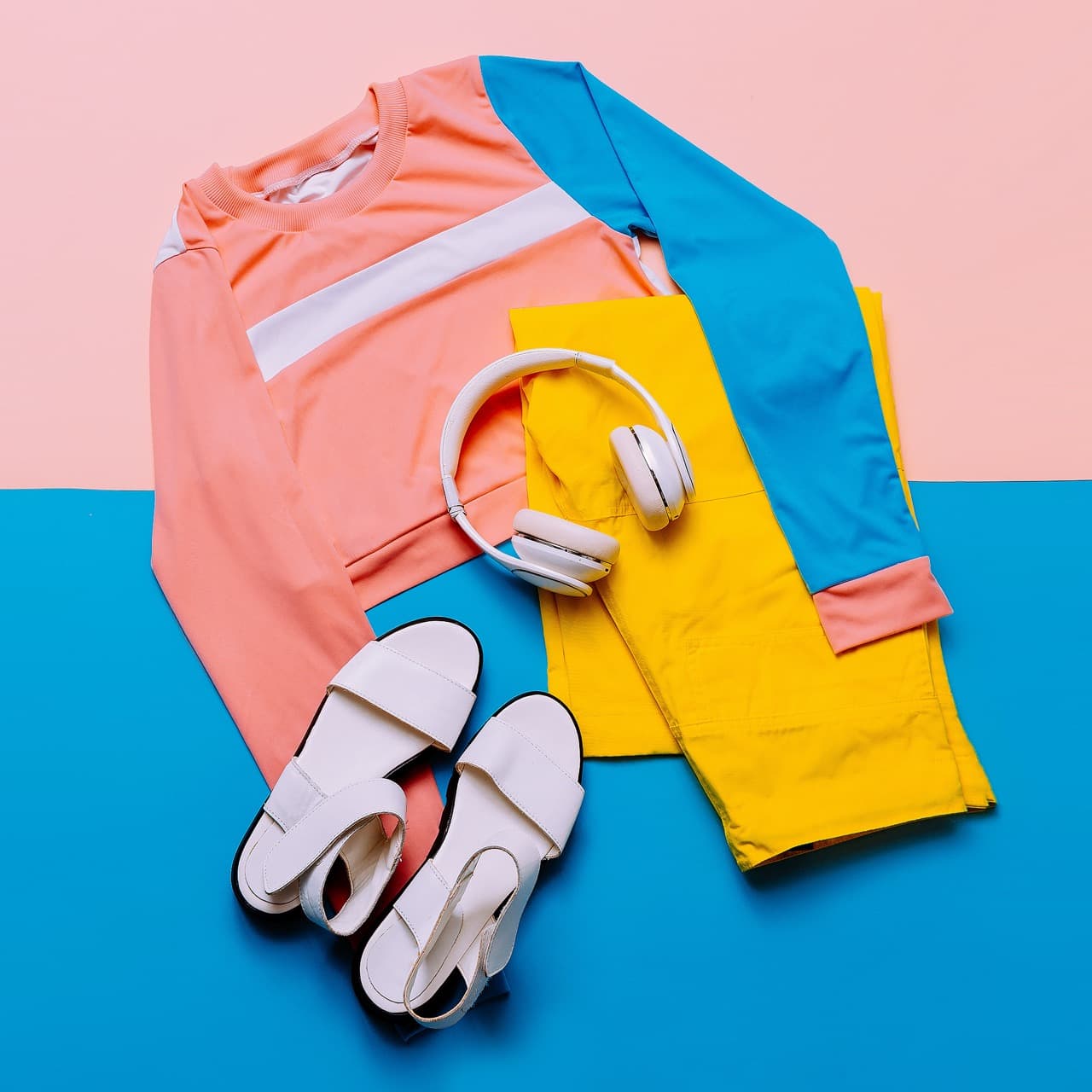 Stylish sports blouse and pants. Pastel trend. Sandals, earphone Minimal stylish clothes Fitness outfit
